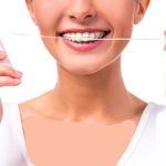 چگونه با ارتودنسی نخ دندان بکشیم؟